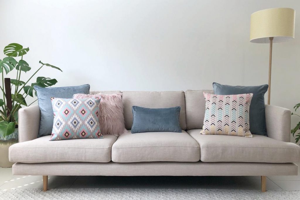 Grey Sofa With Pastel Cushions In Pink Grey And Blue 1024x683 