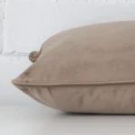 Side perspective showing seam of rectangle oyster cushion cover that has velvet fabric.