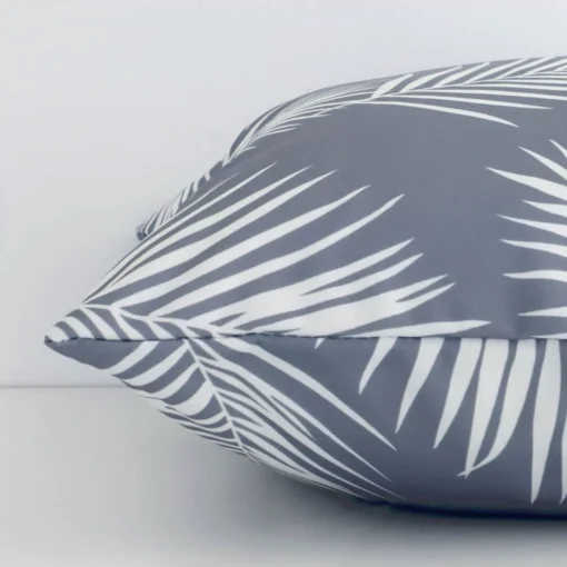 Lateral view of front and back panels of this palm-designed outdoor cushion cover in a square size and with grey colouring.