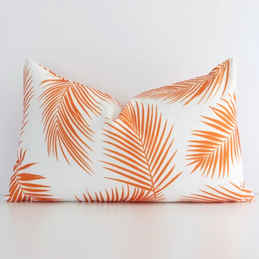 Vibrant orange palm styled cushion cover constructed from outdoor fabric and shown in a rectangle size.