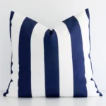 A pretty outdoor cushion cover is shown against a white wall. It features a large size and a navy colour finish.