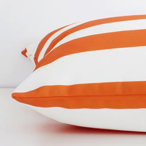 Side image of an outdoor large cushion cover. The striped design and orange colour are visible from the side showing the attachment of the panels.