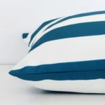 A large outdoor cushion positioned flat to show its seams. The teal colour and striped design are visible as is the seam between the panels.