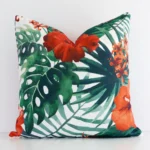 Red solid-coloured cushion cover in front of a white wall. It has a square size and is made from an outdoor material.