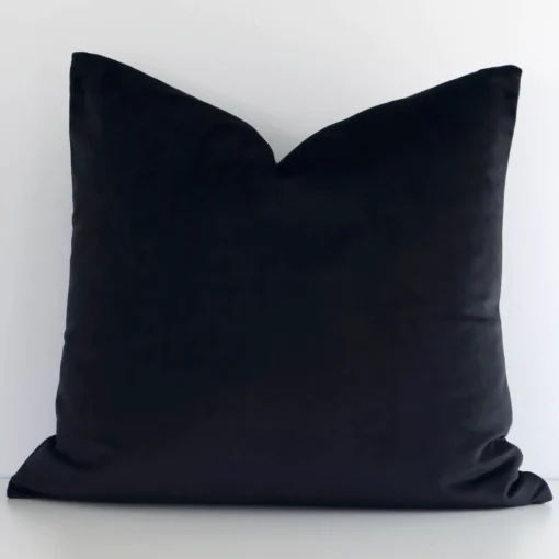 An alluring velvet square cushion cover in black. It features an attractive solid-coloured style.