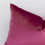 Zoomed photo of the top left corner of this blush solid-coloured cushion cover. The image clearly shows the velvet material and rectangle dimensions.