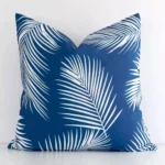 A stunning square outdoor cushion in a blue colour. It has an exquisite palm design.