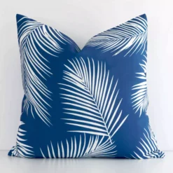 A stunning square outdoor cushion in a blue colour. It has an exquisite palm design.