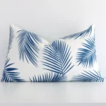 A stunning rectangle outdoor cushion in a blue colour. It has an exquisite palm design.