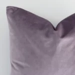 Enlarged shot of a square lavender cushion cover that highlights that solid colour motif on its velvet fabric.