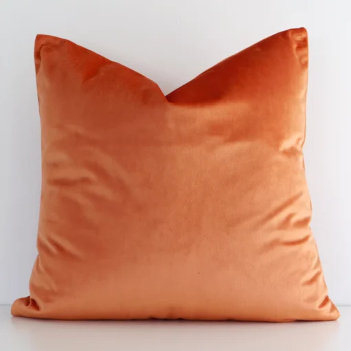 Vibrant solid coloured velvet cushion cover in a stylish square size with orange colouring.