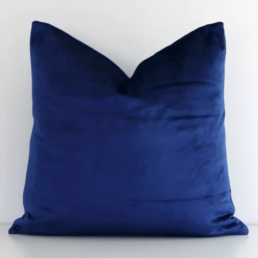 Front view of solid-coloured square cushion. Crafted from a special velvet material in a blue colour.