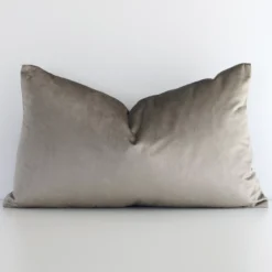 An alluring velvet rectangle cushion cover in taupe. It features an attractive solid colour style.