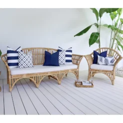 7 outdoor couch cushions in navy colour from the Byron collection look elegant on rattan seats.